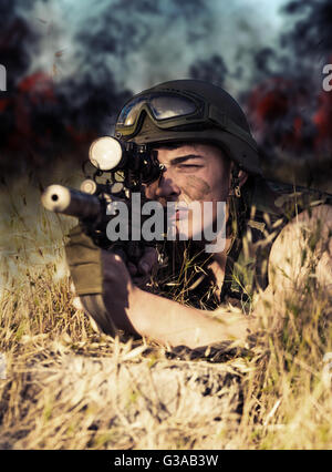 young a soldier in the uniform with weapon Stock Photo
