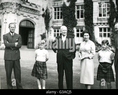 President of the United States, Dwight D. Eisenhower stands outside Balmoral Castle with members of the British Royal family. Left to right: Prince Philip, Princess Anne; The President; Queen Elizabeth; and Prince Charles. The President was visiting England for top level talks with British Prime Minister Harold Macmillan. Stock Photo