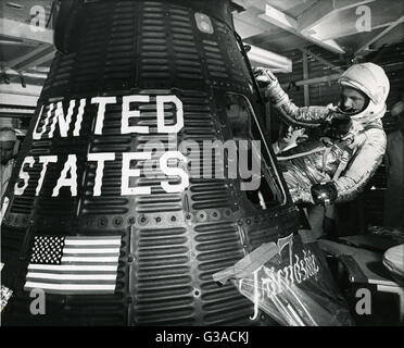 US Astronaut John H. Glenn, Jr. climbs into his Mercury capsule (Friendship 7), during prelaunch preparations for his three orbital flights around the earth. (1962) Glenn was the first US Astronaut to orbit the earth, and the third to make a space flight. Stock Photo