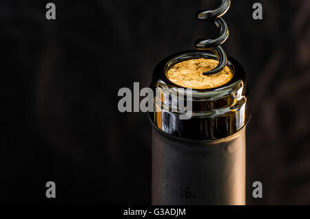 Opening a bottle of wine corkscrew closeup Stock Photo