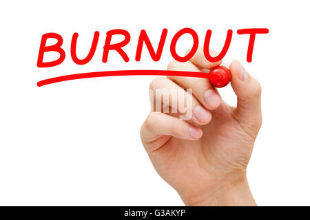 Hand writing Burnout with red marker on transparent wipe board. Stock Photo