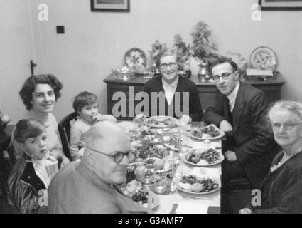 Family Christmas Dinner - 1950s. The young boy (front left) is Stock ...