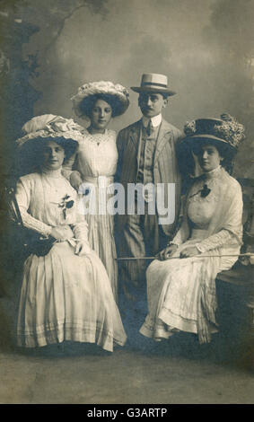German family group in a studio portrait -- a man and three women, all in their smartest clothes.      Date: early 20th century Stock Photo