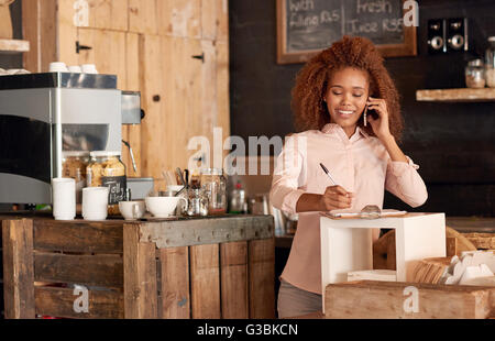 Taking orders and running a successful cafe Stock Photo