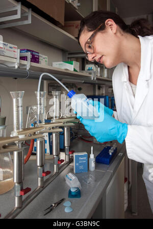Biologist in the laboratory on a filter system for fixation. Stock Photo