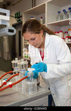 Biologist at a mobile filtration plant in laboratory Stock Photo