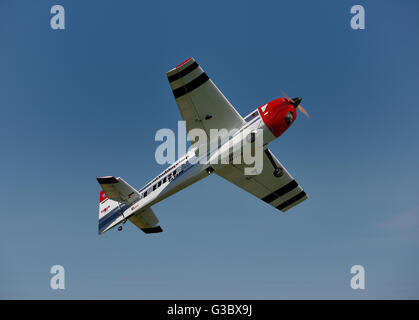 Single prop radio controlled airplane flying overhead Stock Photo