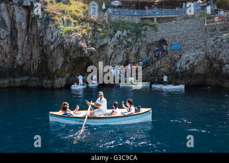 Capri, Italy - August 5, 2015: Boats with tourists waiting to get into the Blue Grotto Stock Photo