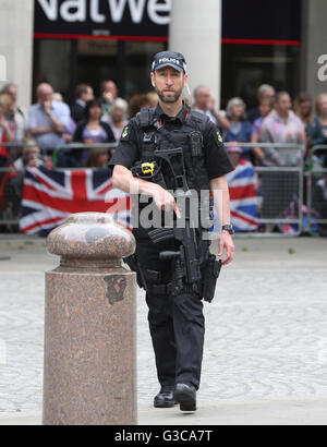 Armed police outside St Paul's Cathedral in London before the start of the a national service of thanksgiving to celebrate the 90th birthday of Queen Elizabeth II. Stock Photo