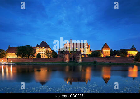 Teutonic Knights in Malbork castle at night.World Heritage List UNESCO. Stock Photo