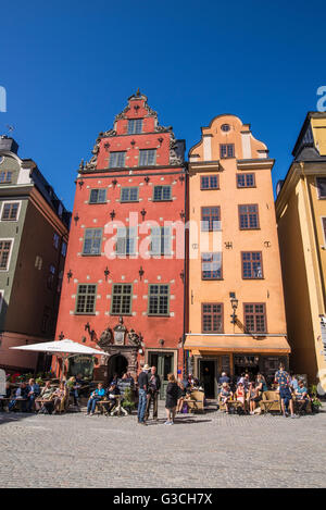 Tourists wonder the streets of Stockholm's historic Stortorget square in the summer. Stock Photo