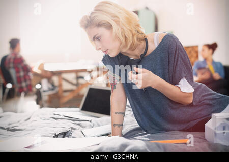 Female college student studying on bed Stock Photo