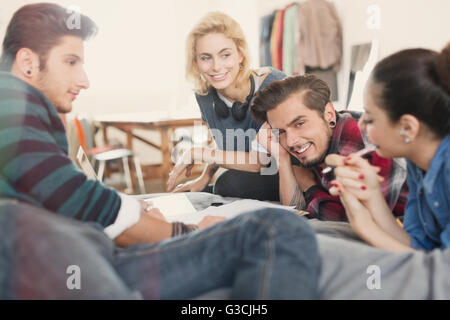 College students studying on bed Stock Photo