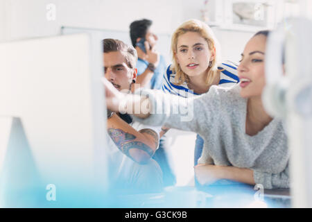 Creative young business people working at computer Stock Photo