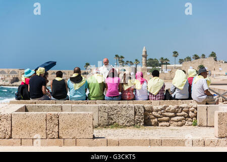 Caesarea, Israel, seaport, excavations, harbour, visitor group, tourists Stock Photo