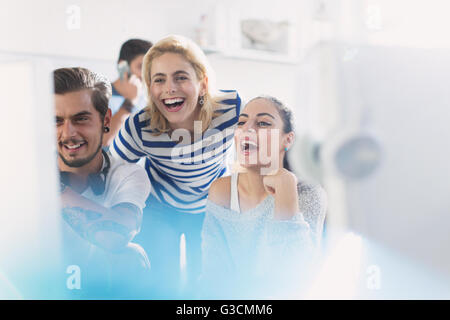 Creative business people laughing at computer in office Stock Photo