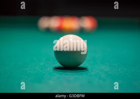 Sizing up the initial shot in a game of billiards. Stock Photo