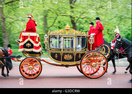 LONDON - MAY 18, 2016: A horse-drawn carriage, the Irish State Coach carries Charles, Prince of Wales and Camilla on the Mall. Stock Photo