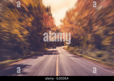 Country asphalt road in motion blur with vintage tone. Stock Photo