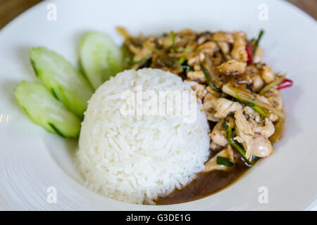 Thai food Thai spicy food, Fried chicken with sweet basil. Stock Photo