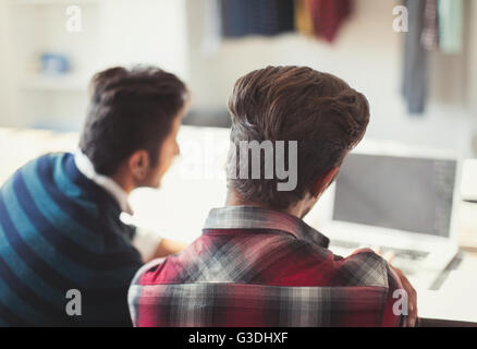 Creative young businessmen working at laptop Stock Photo