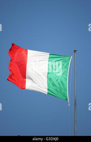 Italian green, white and red flag fluttering in the breeze Stock Photo