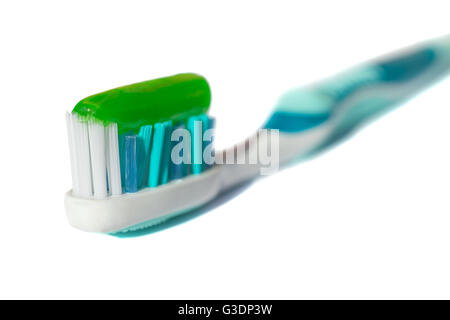Blue toothbrush with green toothpaste isolated on a white background Stock Photo