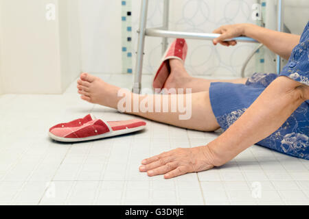 elderly woman falling in bathroom because slippery surfaces Stock Photo