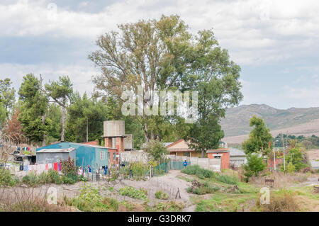 AVONTUUR, SOUTH AFRICA - MARCH 5, 2016: Unidentified people in front of houses in Avontuur, a small town in the Langkloof Stock Photo