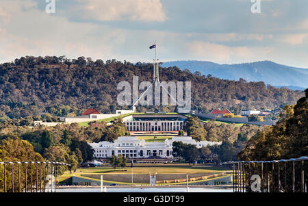 Close-up view of Canberra Capitol hill with New and Old Parliament houses on a line from ANZAC parade across Burley Griffin lake Stock Photo