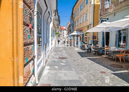 Ljubljana, Slovenia - June 7, 2016 Narrow street in Ljubljanas old town on a bright sunny day Stock Photo
