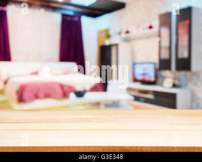 Wooden empty table and blur living room interior Stock Photo