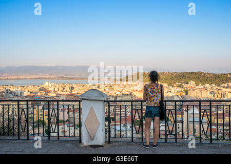 Girl enjoying the panoramic view of the city of Cagliari; Cagliari, Sardinia, Italy Stock Photo