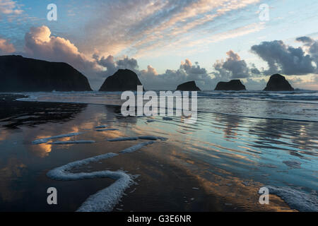 Dusk approaches on Crescent Beach; Cannon Beach, Oregon, United States of America Stock Photo