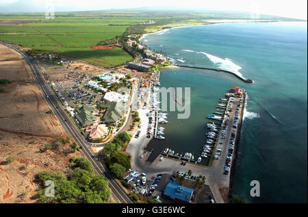 Aerial view of Ma'alaea harbor, whale watching charter boats, Maui Ocean Center Aquarium, Sugar Beach and sugar cane fields in the background Stock Photo