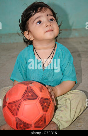 Baby playing with ball Stock Photo