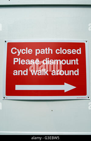 cycle path closed please dismount and walk around, sign in kingston upon thames, surrey, england Stock Photo