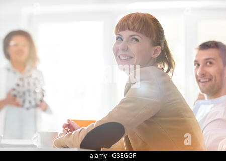 Smiling businesswoman in meeting Stock Photo