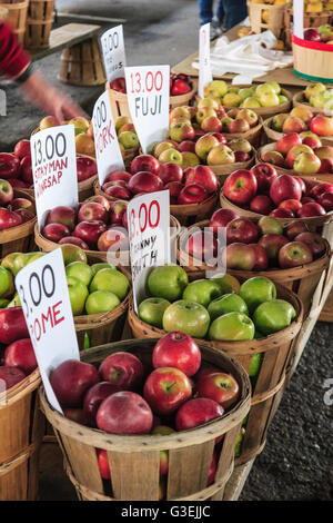 Baskets of apples displayed for sale at the farmer's market in the city. Stock Photo