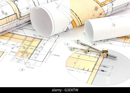 technical project drawings with rolls of architectural blueprints Stock Photo