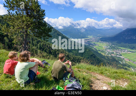 view of Burgrain and Garmisch-Partenkirchen, hikers, Germany, Bayern, Bavaria, Oberbayern, Estergebirge, Upper Bavaria, Farchant Stock Photo