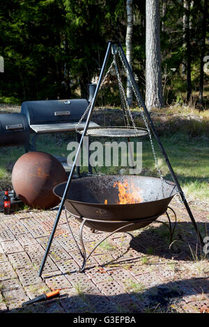 Tripod Swivel Grill Barbecue in the forest Stock Photo