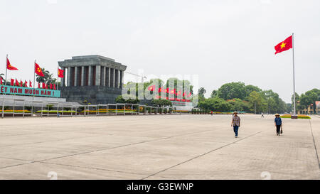 Two Asian tourists visiting the Ho Chi Minh Mausoleum in Ba Dinh Square . Stock Photo