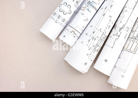 architectural background with rolls of technical drawings Stock Photo