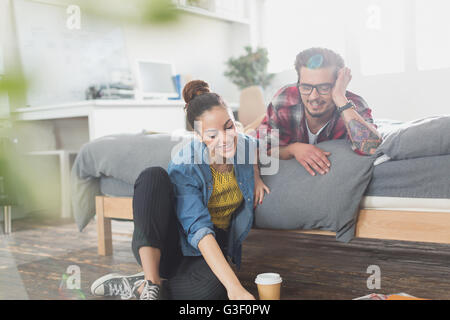 Young couple relaxing in apartment bedroom Stock Photo