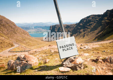 The passing place at the top of Bealach na Ba or Pass of Cattle as it is also known with Loch Kishorn in the background. Stock Photo