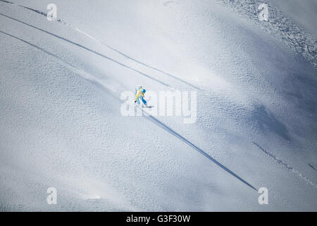 rapid downhill skiing with snowboard in the deep snow Stock Photo