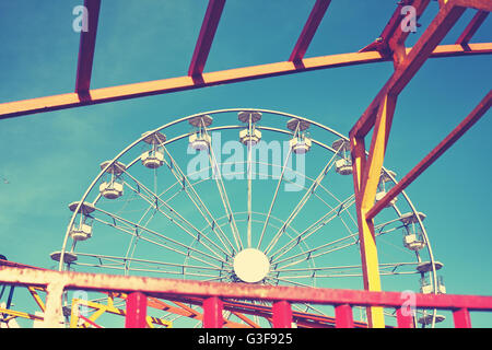 Vintage toned picture of an amusement park. Stock Photo