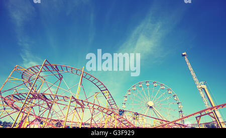 Vintage toned picture of an amusement park. Stock Photo