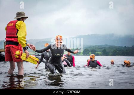 Swimmers take part in the Great North Swim on Lake Windermere in Cumbria. Stock Photo